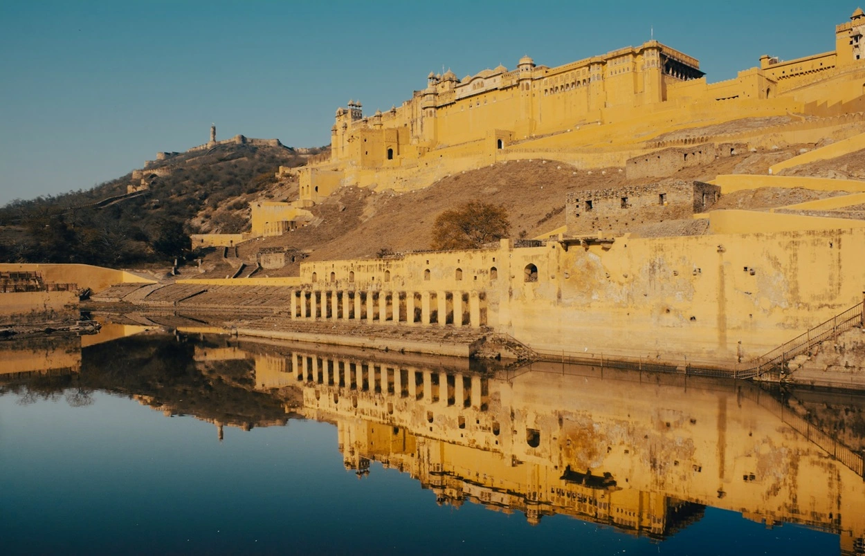 Front view of Amber Fort Jaipur perched on a hilltop overlooking Maota Lake