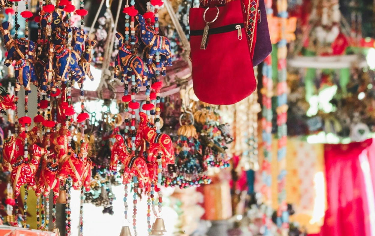 Colorful traditional Rajasthani textiles and footwear displayed at Bapu Bazar Jaipur