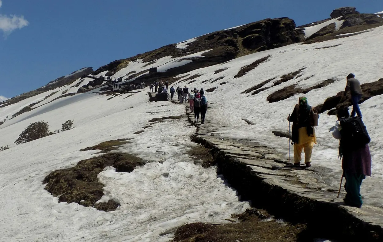 Snow covered Chopta valley in winter and green meadows in summer