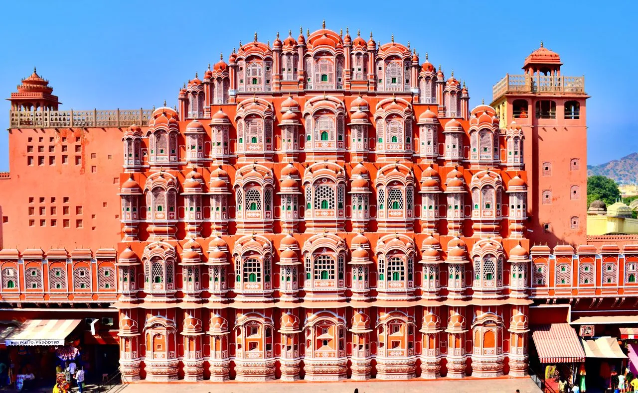 The iconic red and pink sandstone facade of Hawa Mahal in Jaipur Rajasthan