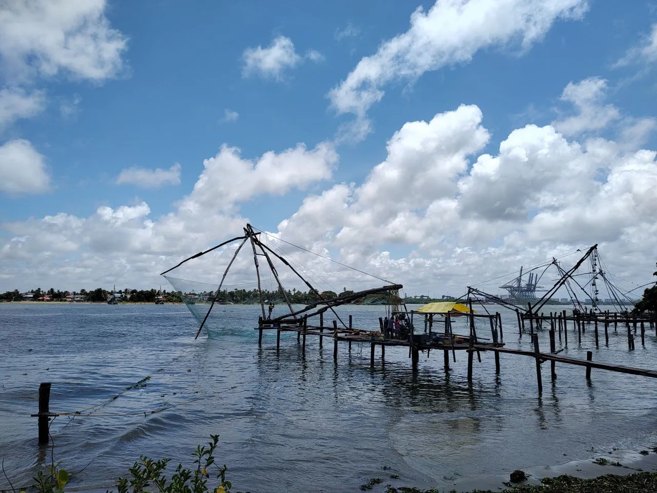 Silhouetted giant Chinese fishing nets along the coastline of Fort Kochi Kerala