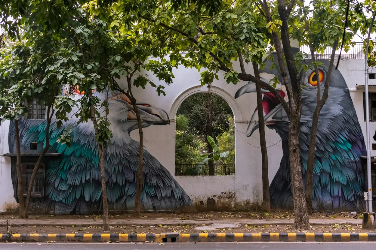 Massive vibrant street art wall mural on a building facade in Lodhi Art District Delhi