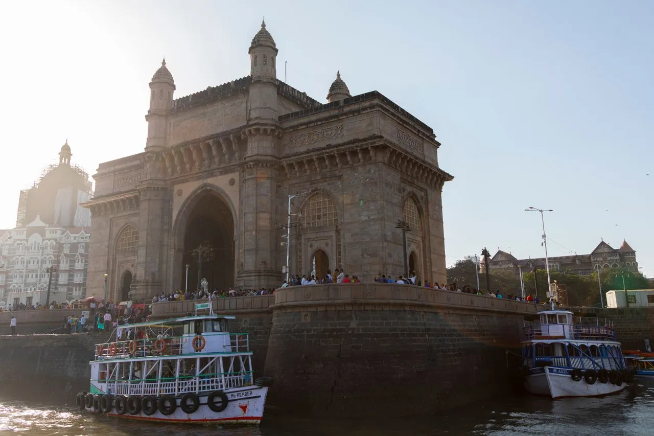 Basalt stone archway of the Gateway of India against the Arabian Sea in Mumbai