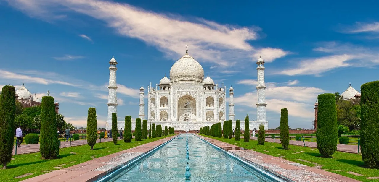 Collage of top travel destinations in India including Taj Mahal Agra, Ladakh mountains, and Kerala backwaters