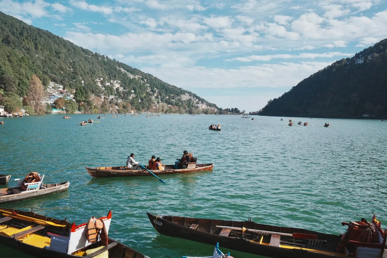 Colorful wooden boats floating on Naini Lake in Nainital hill station