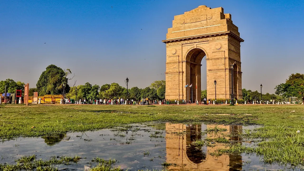 Wide angle shot of iconic landmarks in Delhi including India Gate and sandstone architecture