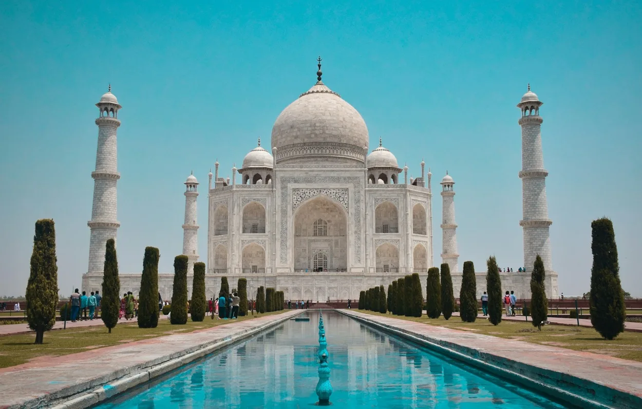 Front view of Taj Mahal marble mausoleum in Agra at sunrise, one of the most famous places in India