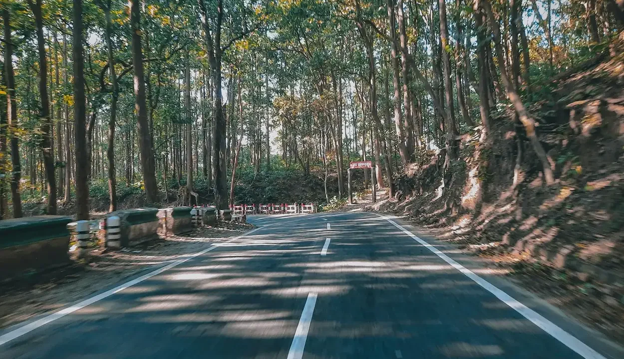 Scenic mountain road leading to a hill station near Delhi for a weekend getaway