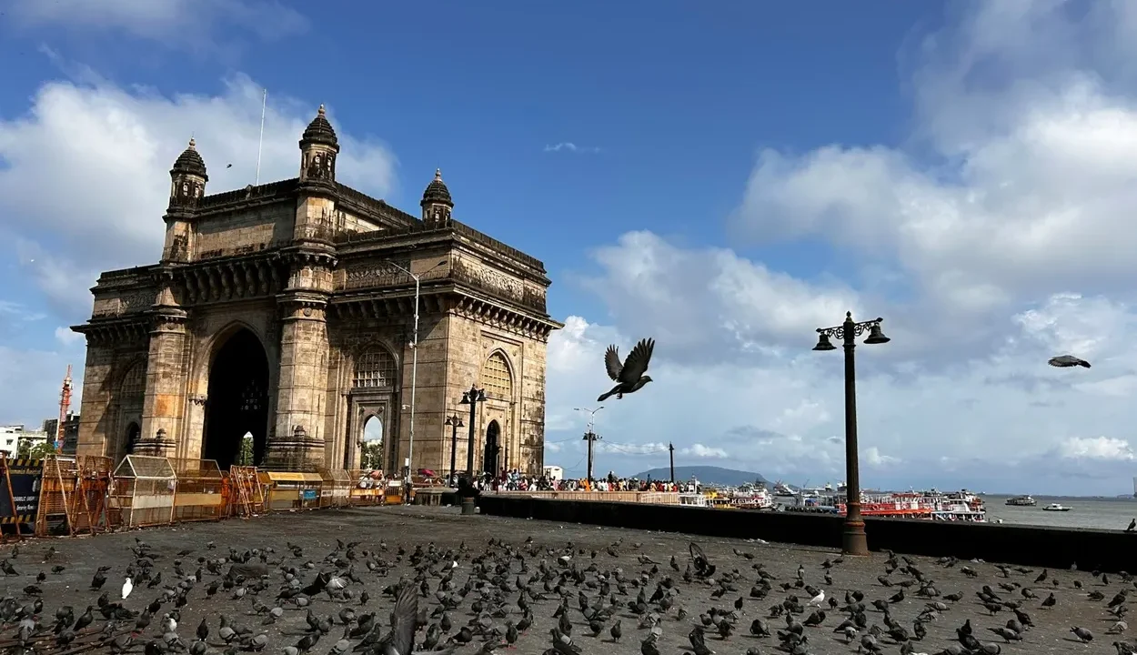 Yellow basalt arch of the Gateway of India overlooking the Arabian Sea and Mumbai Harbour in Colaba, Mumbai