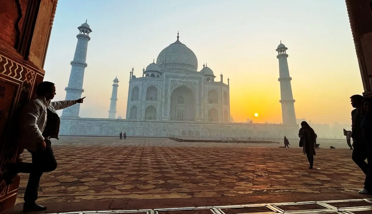 Sunrise framed view of Taj Mahal through an archway for Agra 1 day itinerary
