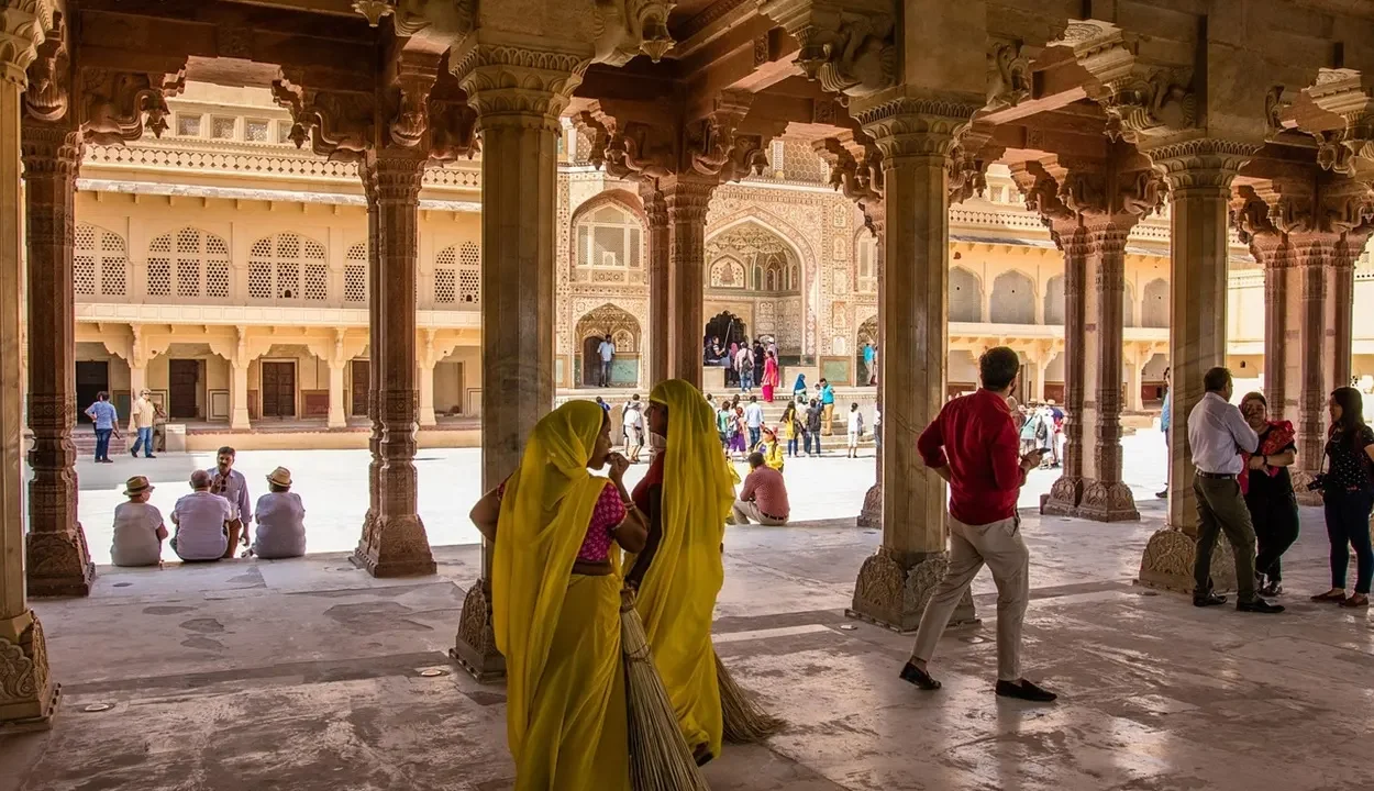 Tourists visiting Amber Fort courtyard, one of the top places to visit in Jaipur